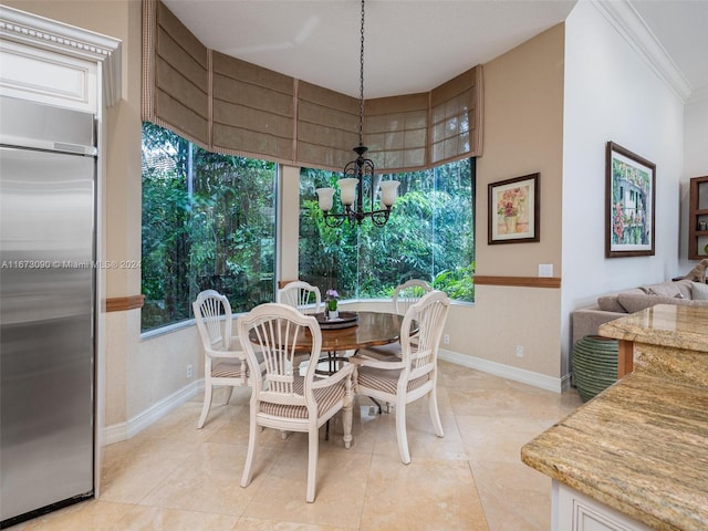 dining room with an inviting chandelier, light tile patterned floors, and ornamental molding