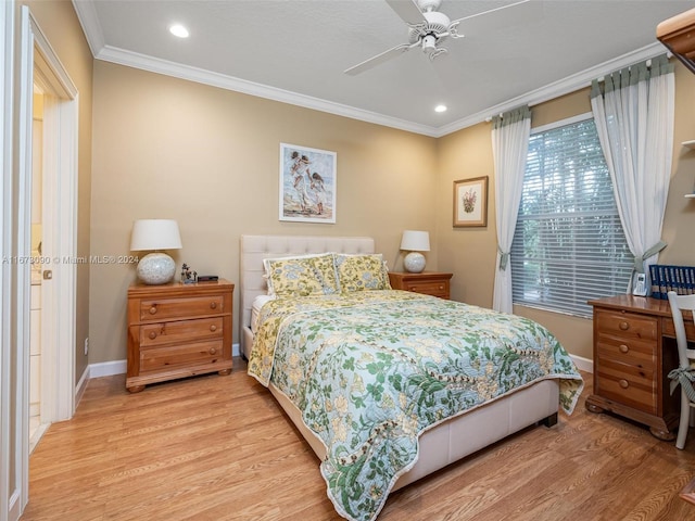 bedroom featuring light hardwood / wood-style floors, ceiling fan, and crown molding