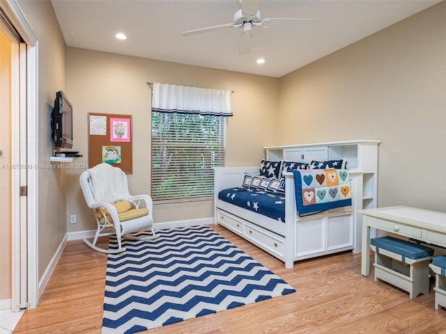 bedroom with ceiling fan and light hardwood / wood-style flooring