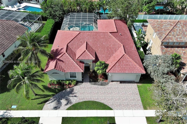 view of subject property with a pool