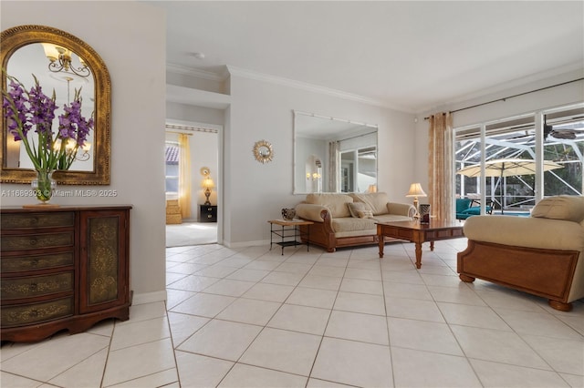 living area with ornamental molding, light tile patterned floors, and baseboards