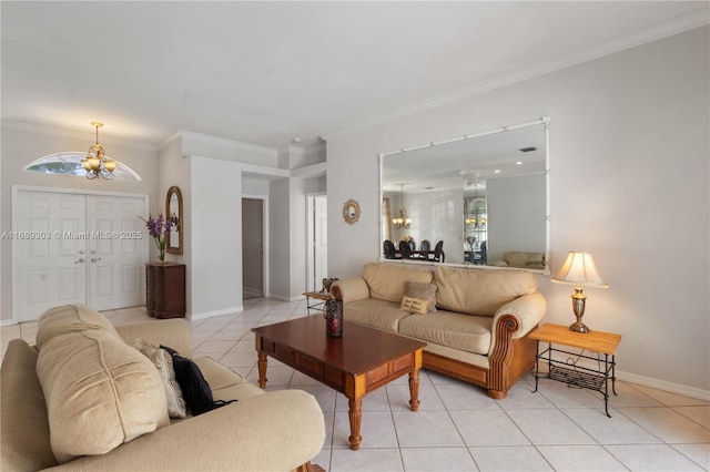 living area featuring a chandelier, light tile patterned floors, crown molding, and baseboards