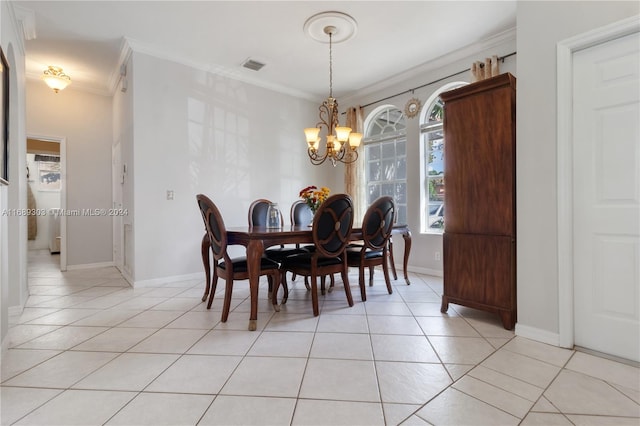 dining space featuring light tile patterned flooring, ornamental molding, and a chandelier