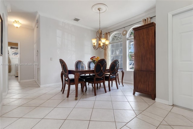 dining space featuring light tile patterned floors, ornamental molding, a chandelier, and baseboards