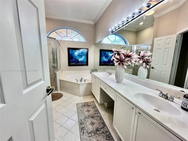 bathroom featuring tile patterned flooring, crown molding, a stall shower, a bath, and double vanity