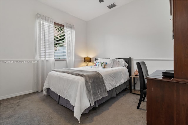 bedroom featuring carpet floors, vaulted ceiling, and baseboards