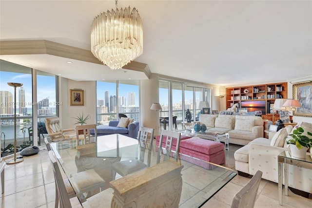 dining room with a wall of windows, a water view, and an inviting chandelier