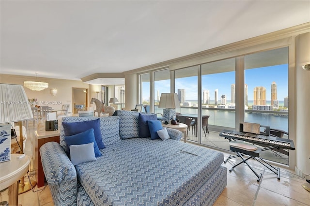 living room with a water view and a notable chandelier