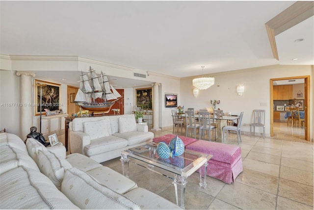 living room with a notable chandelier and crown molding