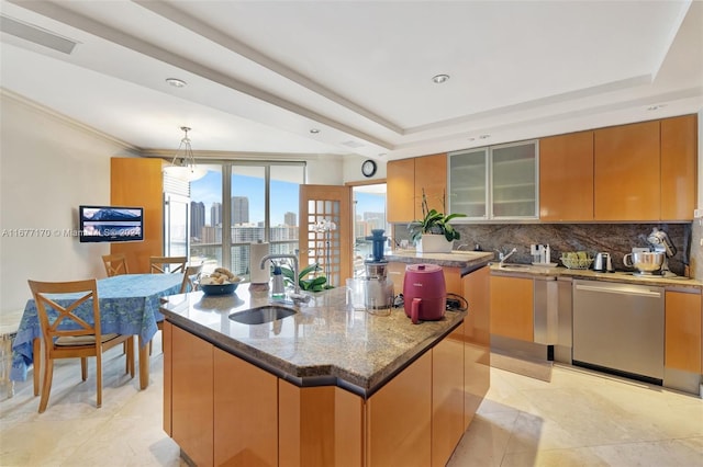 kitchen with dishwasher, a wealth of natural light, sink, and a center island with sink