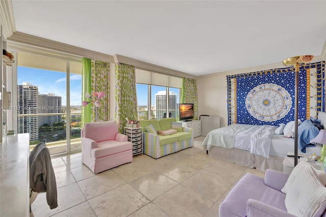 bedroom with access to exterior, multiple windows, and crown molding