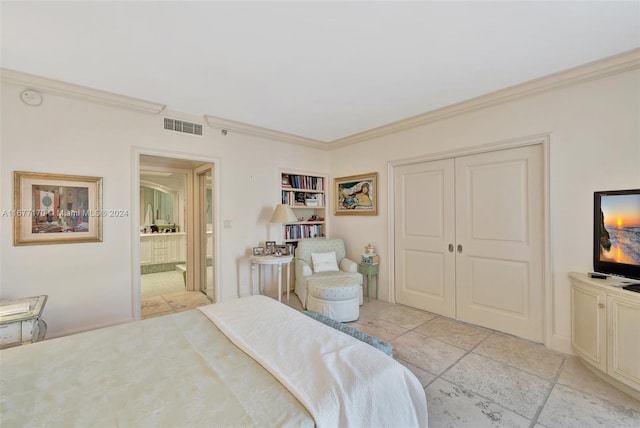 bedroom with a closet and crown molding