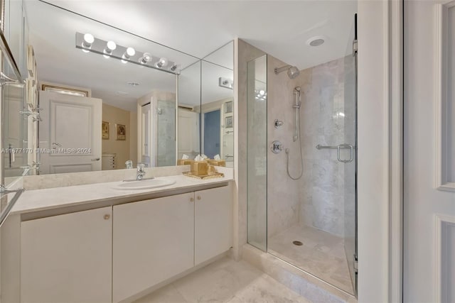 bathroom featuring vanity and an enclosed shower