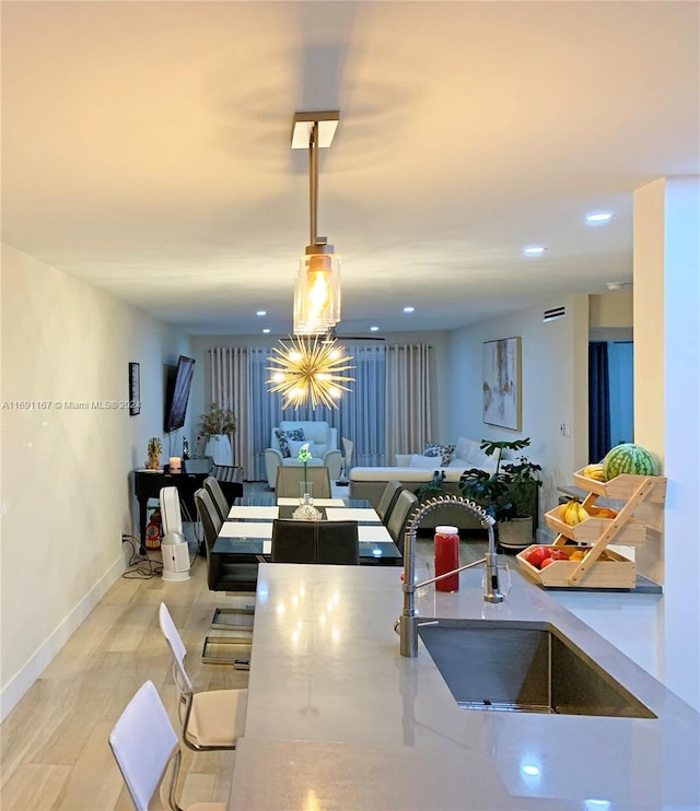 kitchen featuring hanging light fixtures and sink