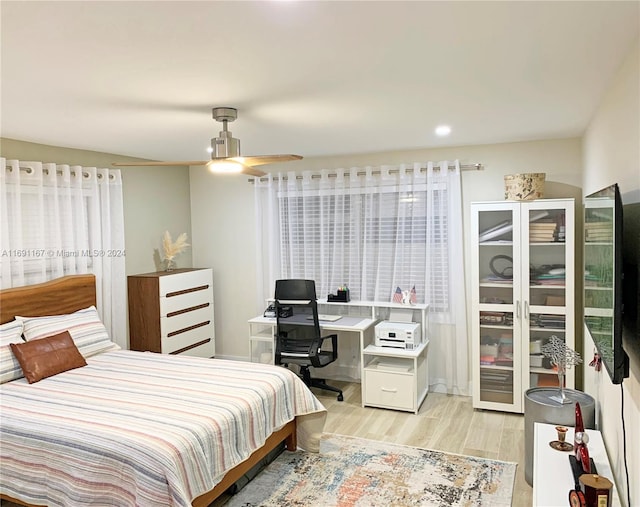 bedroom featuring ceiling fan and light wood-type flooring