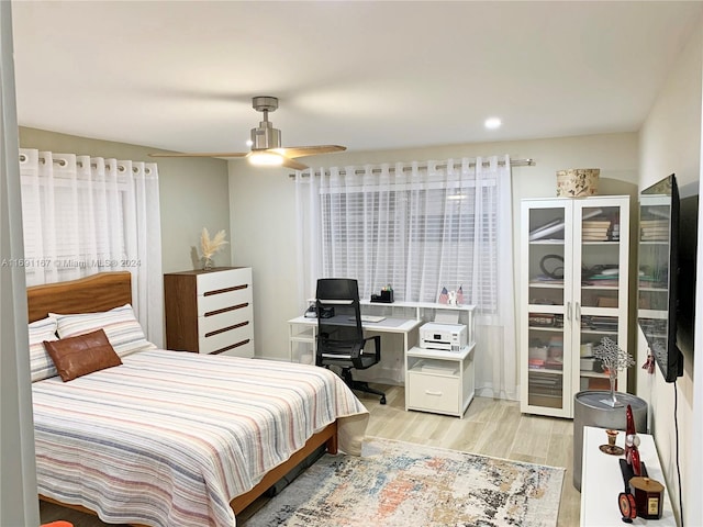 bedroom featuring ceiling fan and light hardwood / wood-style floors