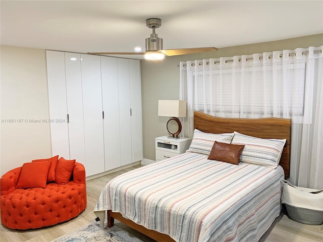 bedroom featuring ceiling fan and light hardwood / wood-style floors