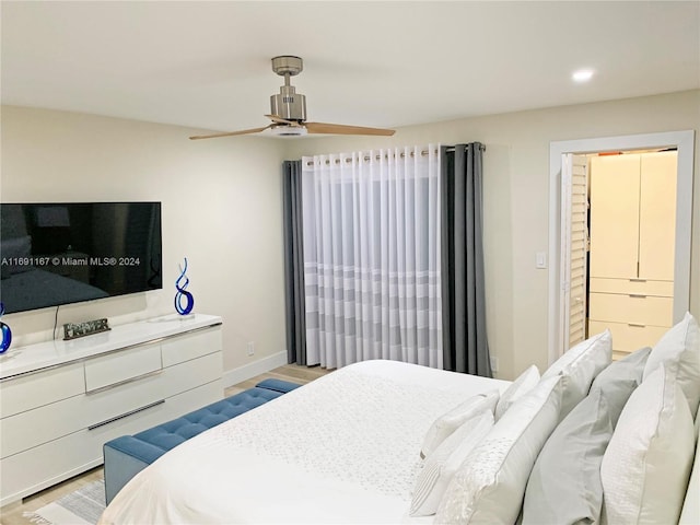 bedroom featuring light wood-type flooring and ceiling fan