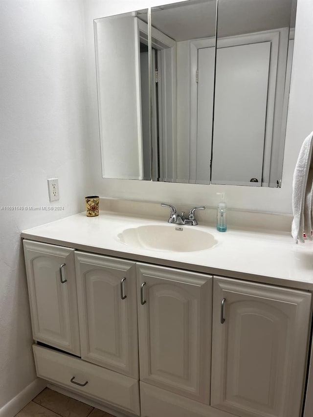 bathroom with vanity and tile patterned floors