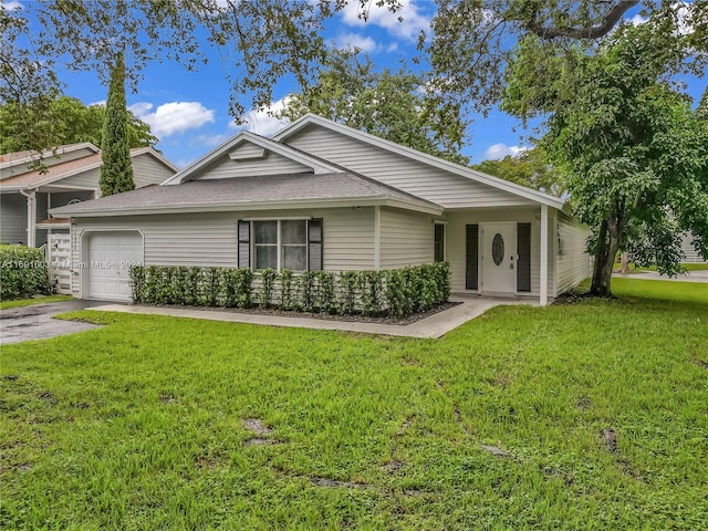 ranch-style home featuring a garage and a front lawn