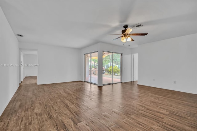 spare room with hardwood / wood-style floors and ceiling fan