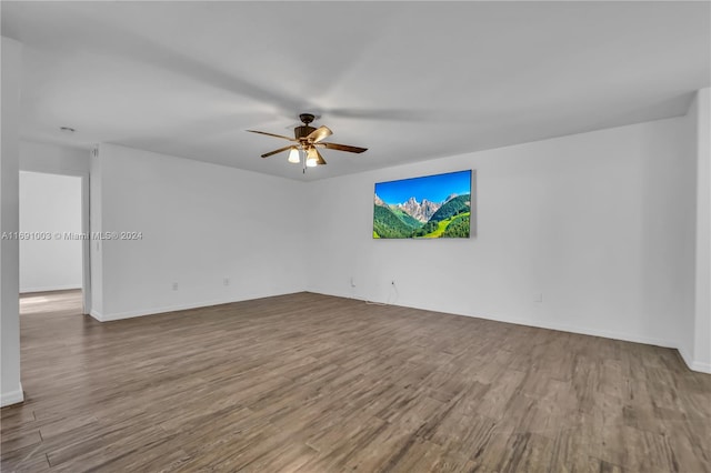 empty room with wood-type flooring and ceiling fan