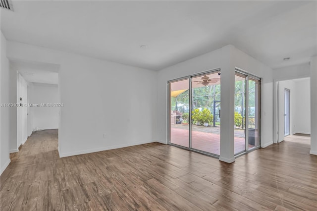 empty room with wood-type flooring