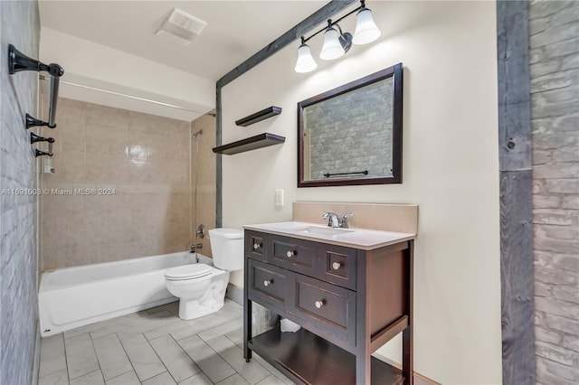 full bathroom with vanity, tiled shower / bath combo, and toilet