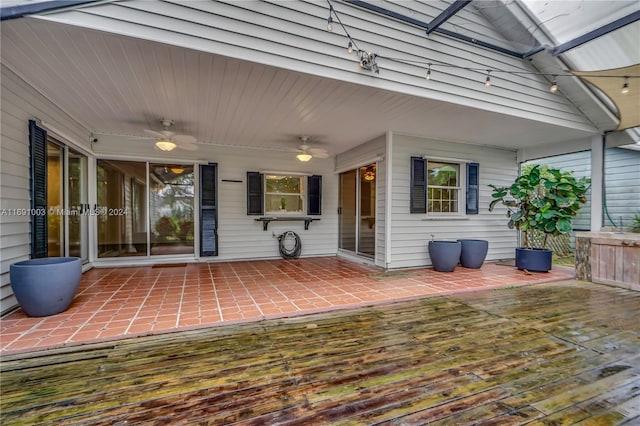 wooden deck featuring a patio and ceiling fan