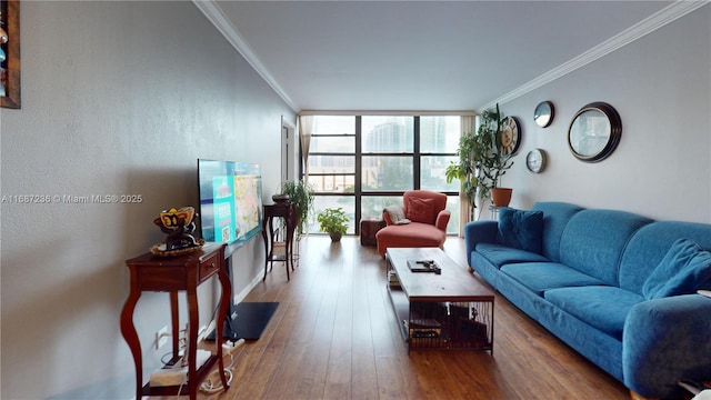 living room with hardwood / wood-style floors, expansive windows, and ornamental molding