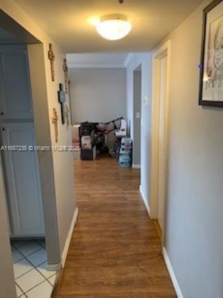 hallway with tile patterned flooring