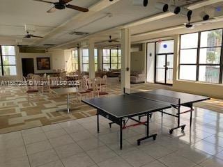 recreation room with ceiling fan and light tile patterned floors