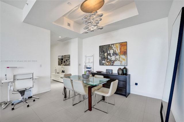 dining space with a tray ceiling