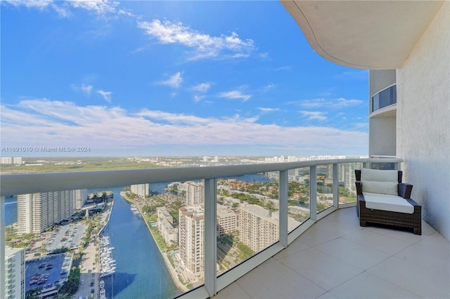 balcony featuring a water view