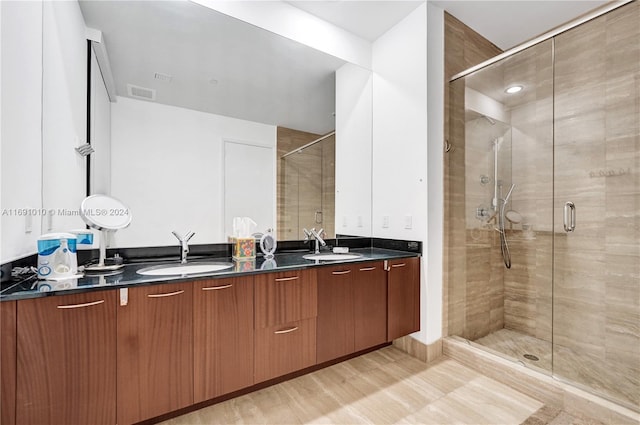 bathroom with vanity and an enclosed shower