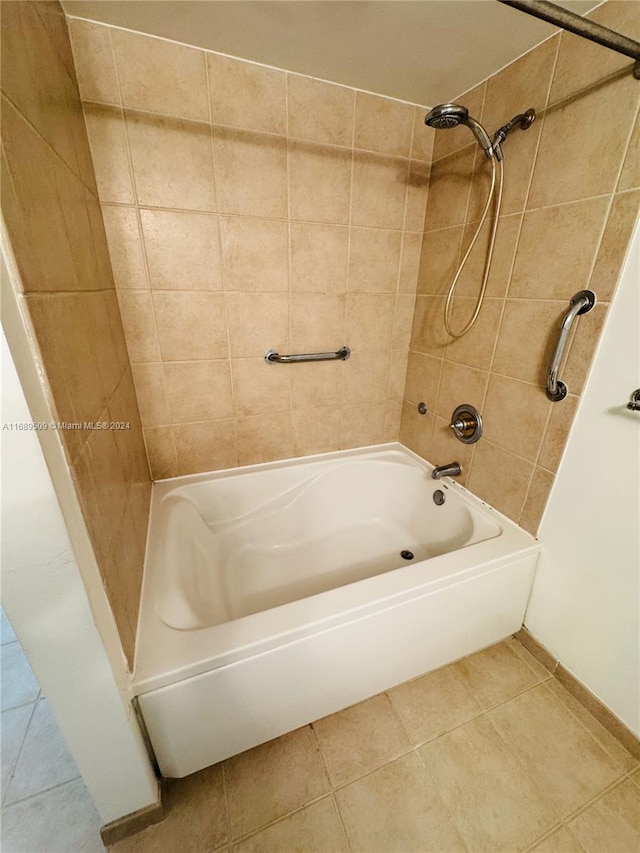 bathroom featuring tiled shower / bath combo and tile patterned floors