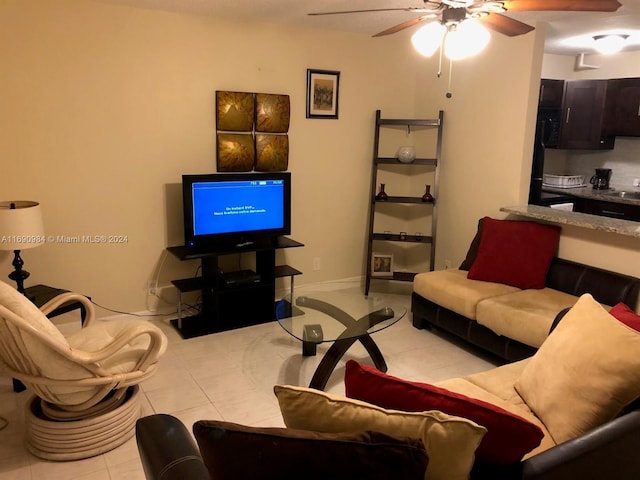 living room with light tile patterned floors and ceiling fan