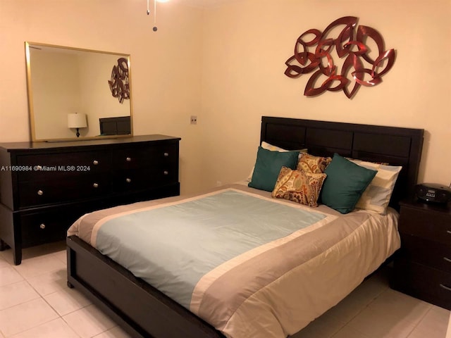 bedroom with light tile patterned flooring