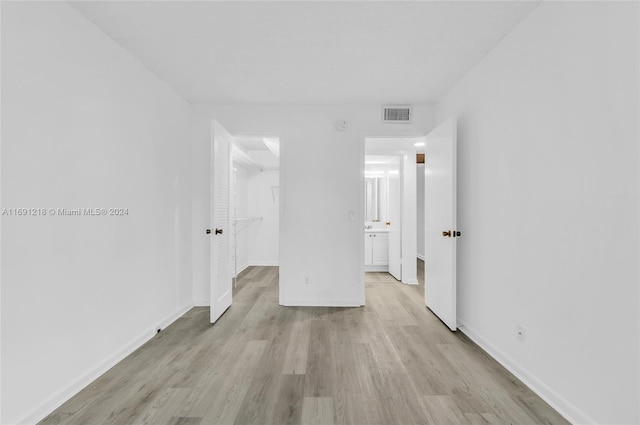 spare room featuring light wood-type flooring