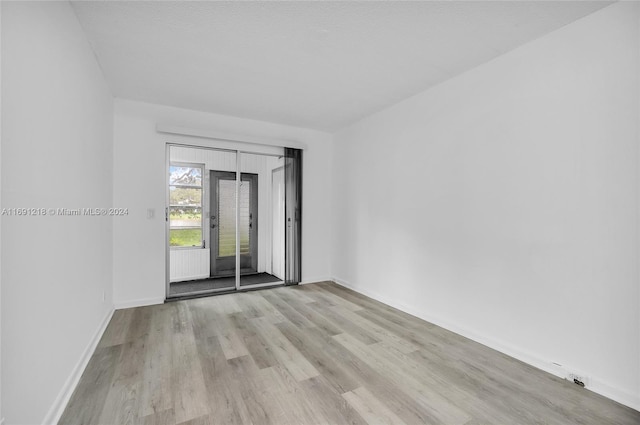 empty room with light wood-type flooring