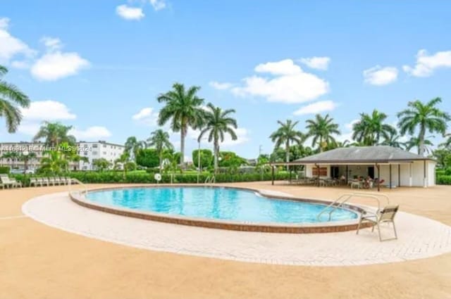 view of swimming pool featuring a patio area