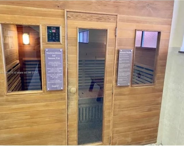 view of sauna / steam room with wood walls