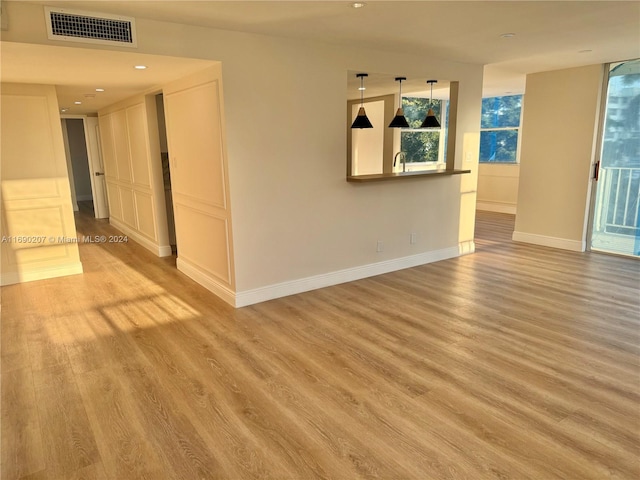 spare room with sink and light wood-type flooring