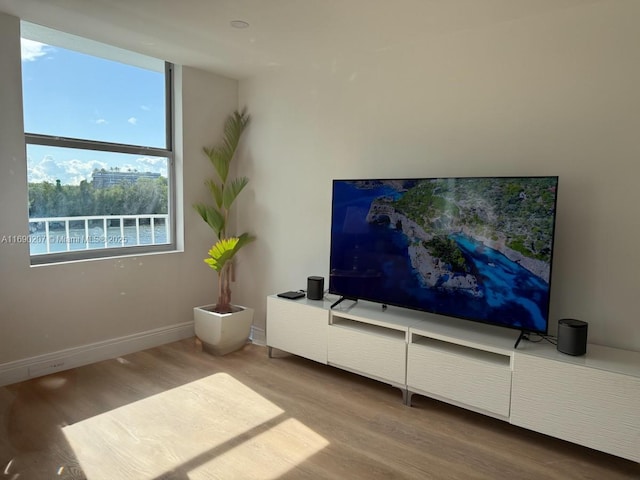 16546 NE 26th Ave Unit 3G, North Miami Beach, FL 33160 - living area featuring wood finished floors and baseboards