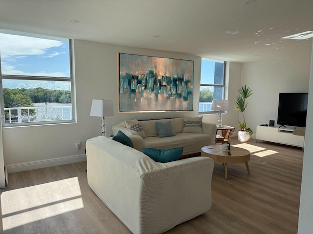 16546 NE 26th Ave Unit 3G, North Miami Beach, FL 33160 - living room with wood finished floors and baseboards