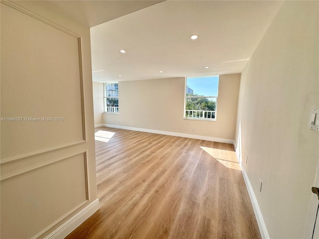 16546 NE 26th Ave Unit 3G, North Miami Beach, FL 33160 - spare room featuring light wood-style floors and recessed lighting