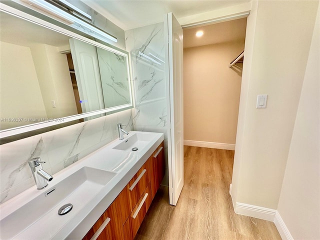 bathroom featuring hardwood / wood-style floors and vanity