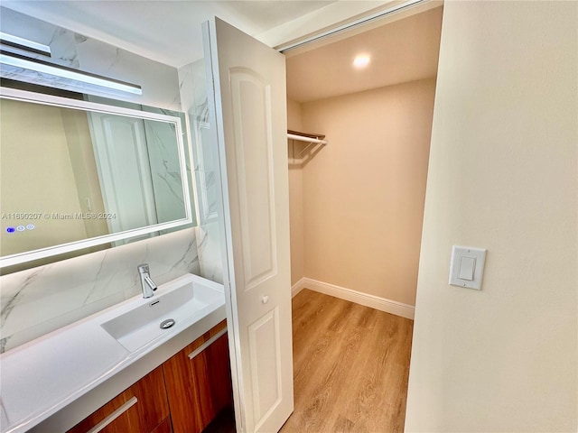 bathroom featuring vanity and hardwood / wood-style flooring