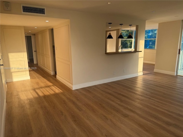 16546 NE 26th Ave Unit 3G, North Miami Beach, FL 33160 - empty room with wood finished floors and recessed lighting