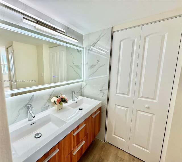 bathroom featuring hardwood / wood-style floors and vanity